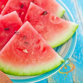 Florida Giant watermelon seeds by SeedsNow, close-up of large, striped green watermelon seeds on a white background.